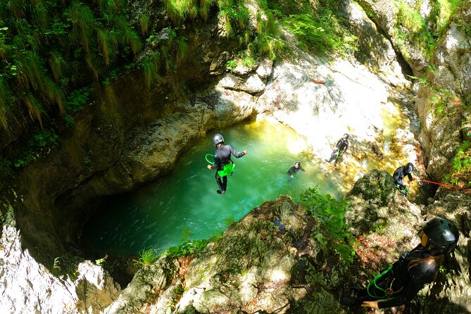 Dynamic Adventure Canyoning in Bovec with Free Photos and Videos - The 12-meter waterfall rappel