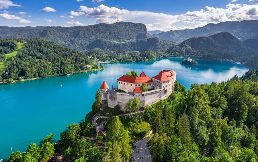 From Ljubljana: Postojna Cave, Predjama Castle and Lake Bled - Inside Postojna Cave: a cool ride underground