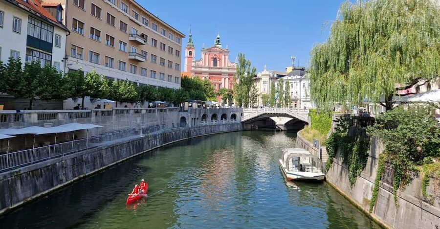 From Zagreb: Highlights Day Tour to Bled and Ljubljana - Reaching Lake Bled from the castle above