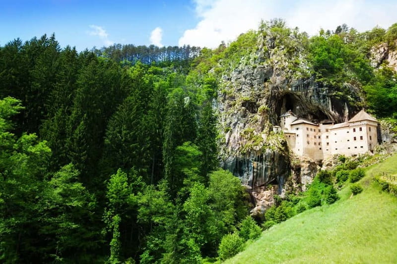Koper/Trieste: Postojna Cave & Predjama Castle Tour & Ticket - Exploring Predjama Castle inside its 123-meter cliff