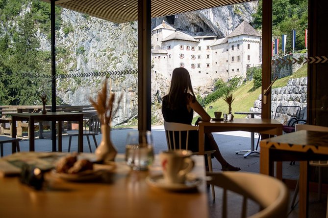 Postojna Cave & Photostop Predjama castle - Group Tour from Koper - Predjama Castle in only 15 minutes