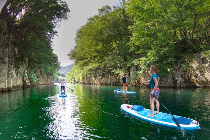 Private Half Day Stand-up Paddle Boarding on the Soča River - A beach stop with fruit and potato chips